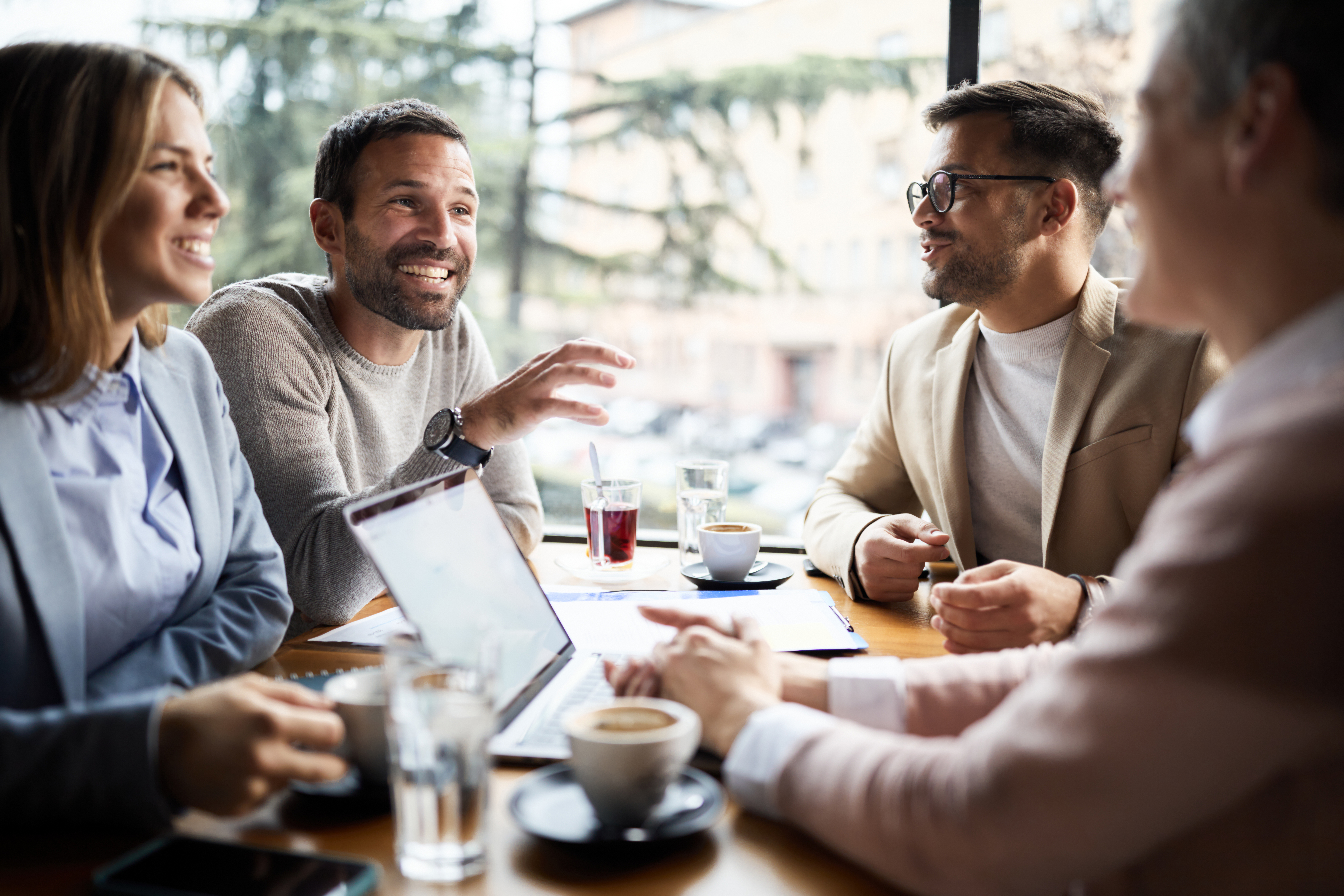 An informal meeting in a café, standing for human partnership