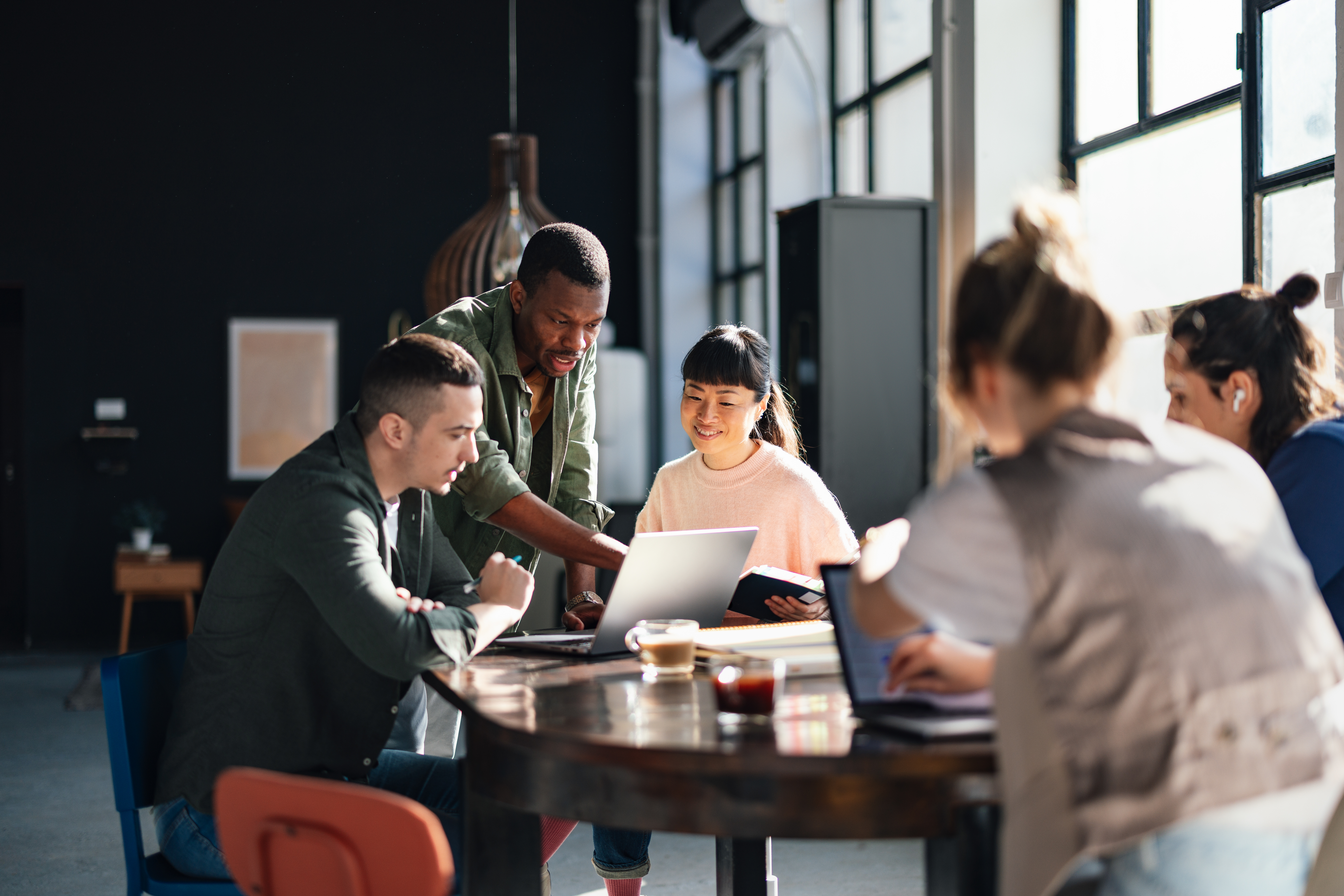 A mixed team collaborating in a modern workspace